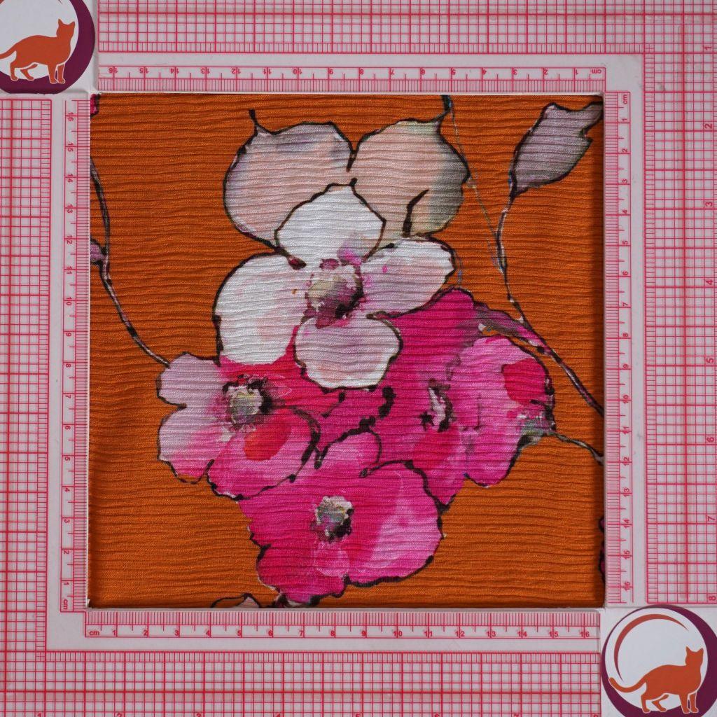 Viskose Plissé Blumen orange pink